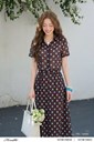 z8040792387853_258c66bbdcd050878262b869e6d346ea Ảnh của Áo sơ mi dáng croptop họa tiết chấm bi